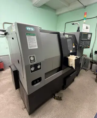 Токарный станок с ЧПУ DMC DL 6TM+автомат подачи прутка (барфидер) DH65LS 1.5 mm