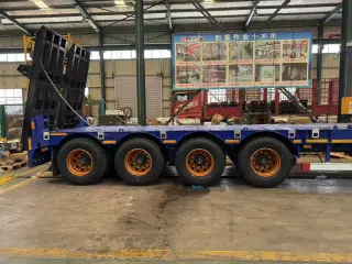 Полуприцеп-трал с трапами TONGYADA CTY9804TDPS 4-оси, грузоподъёмностью 65 тонн, новый