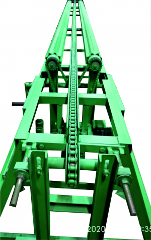 Кантователь бревна для брусующих станков с установкой редуктора вальцов по диаметру бревна