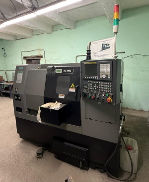 Токарный станок с ЧПУ DMC DL 6TM+автомат подачи прутка (барфидер) DH65LS 1.5 mm
