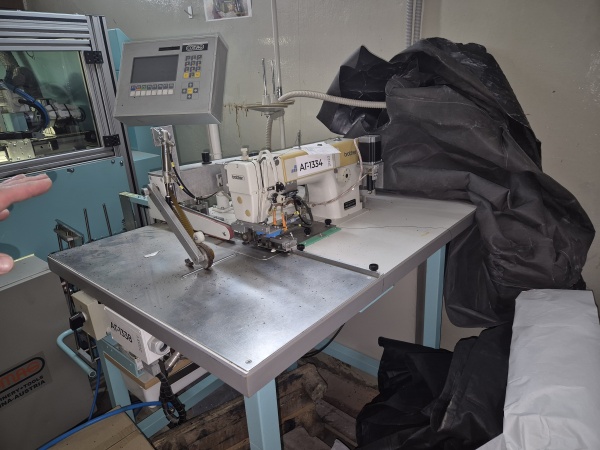 Швейная машина-робот Brother Industries для шитья переплетных крышек